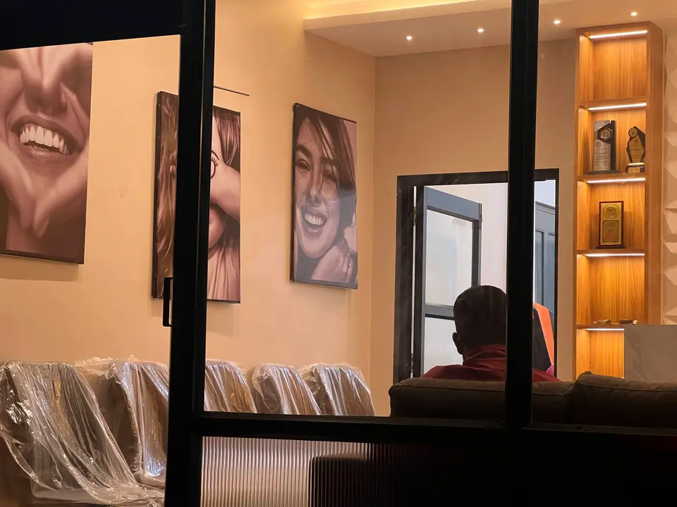 Reception detail with framed black-and-white smile photography
